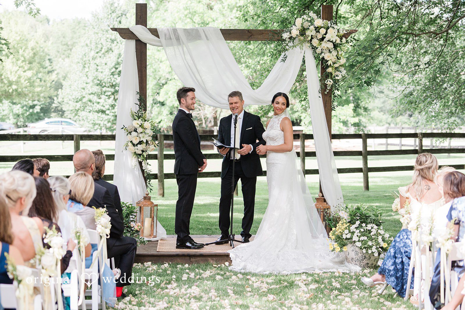 Wedding ceremony moment with the couple standing before the priest at Chicago Backyard