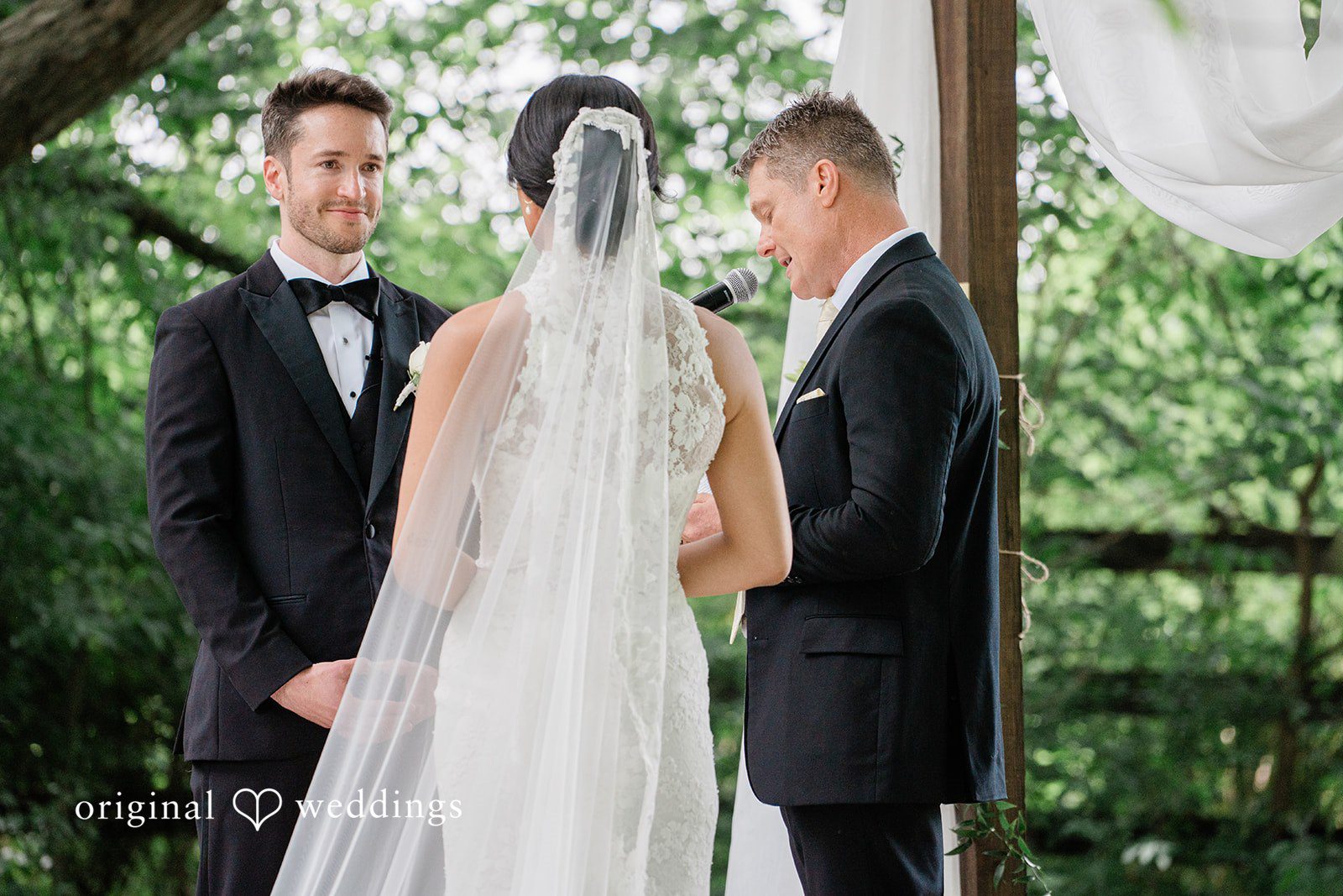 Back view of the bride infront of groom at Chicago Backyard