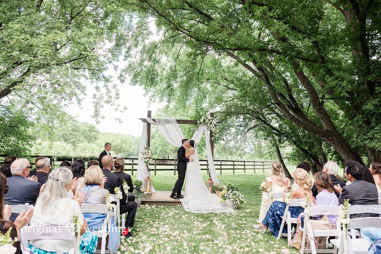 Bride and groom kissing during their wedding session at Chicago Backyard
