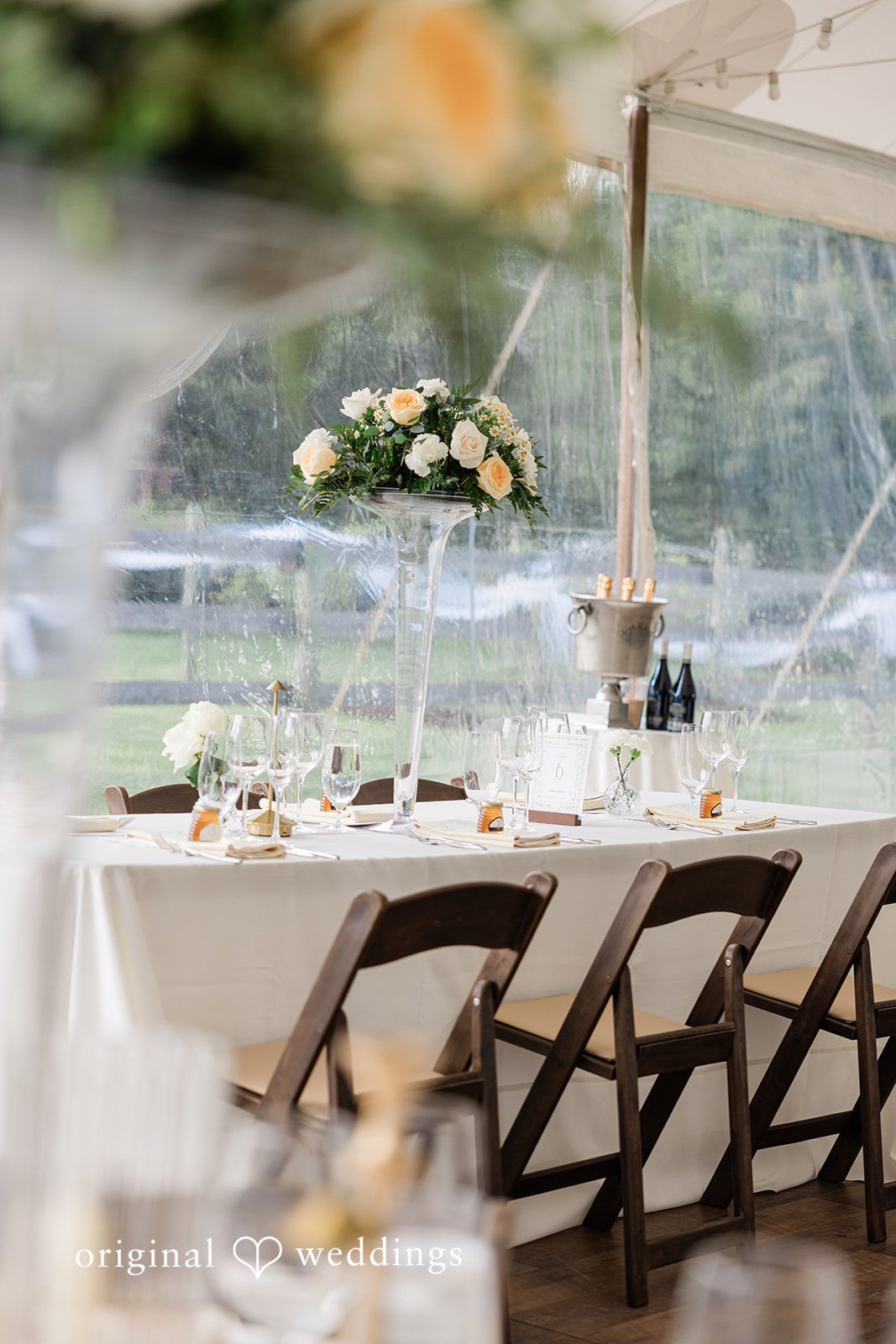 Center table decorated with flowers and glass vases at Chicago Backyard