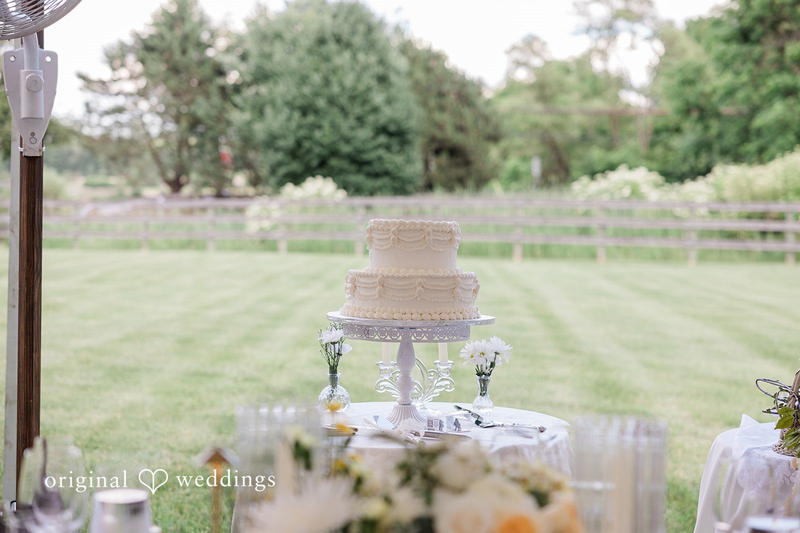 Elegant wedding cake decorated for the reception at Chicago Backyard