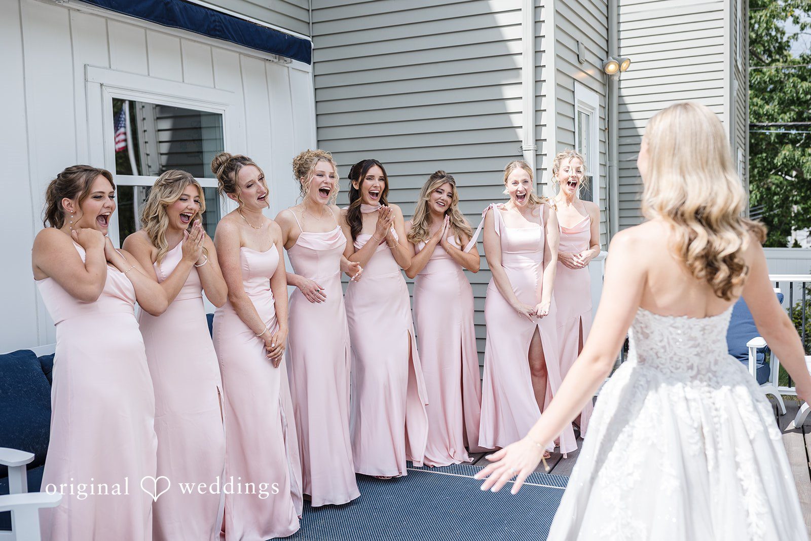 Emily + Jacob The bride shows herself to her bridesmaids