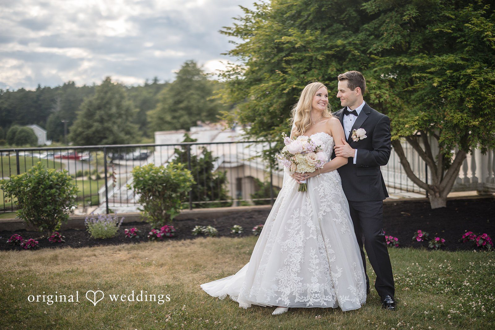 Emily + Jacob Our Boston wedding photographers at Original Weddings captured a stunning portrait of the couple at the Indian Pond Country Club