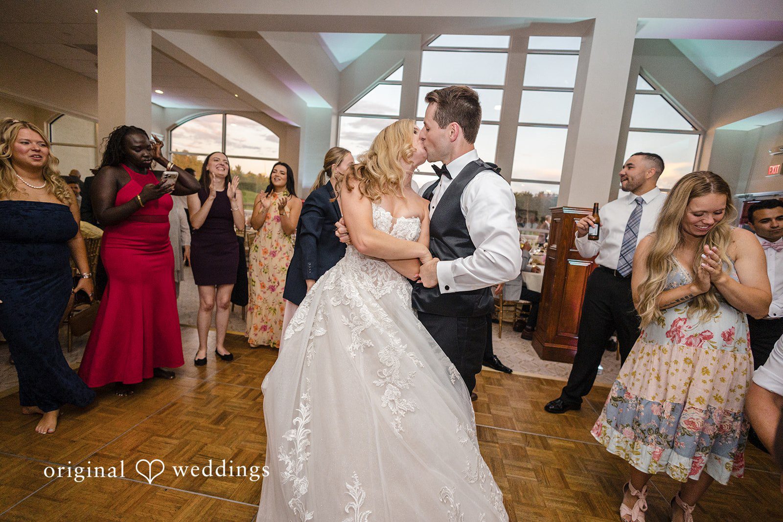 Emily + Jacob The couple shares a romantic kiss