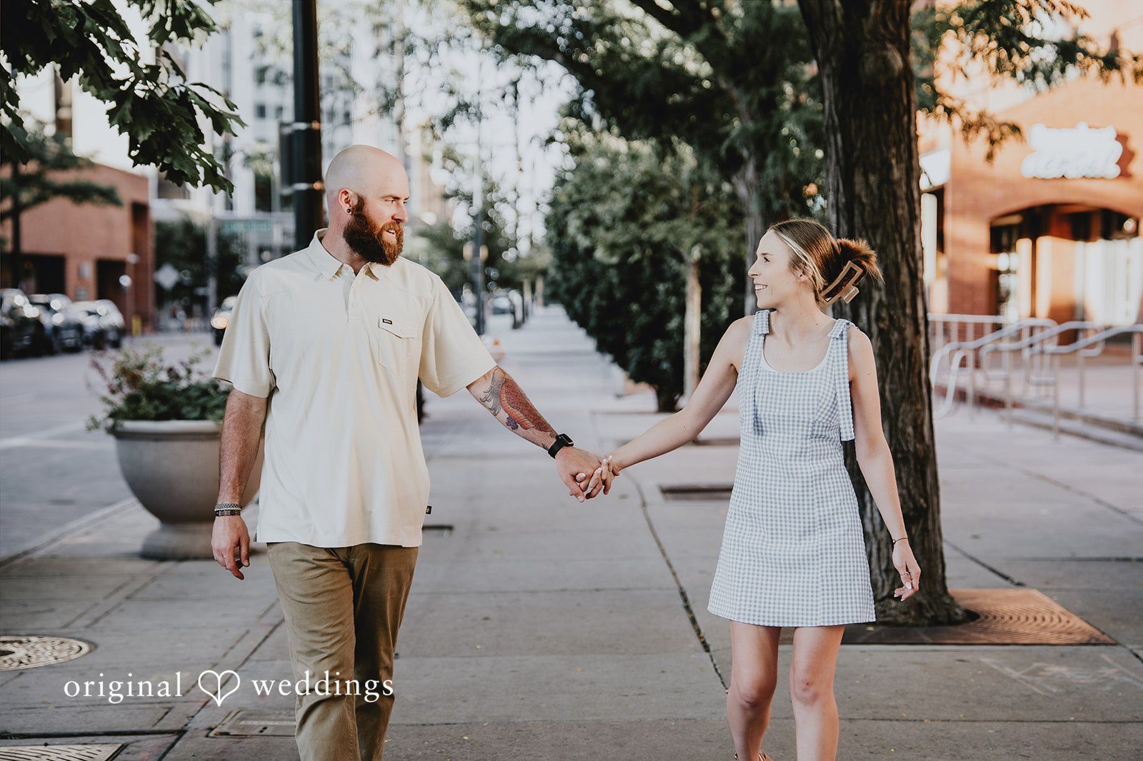 Our Denver engagement photographers at Original Weddings captured a stunning portrait of the couple at Larimer Squa