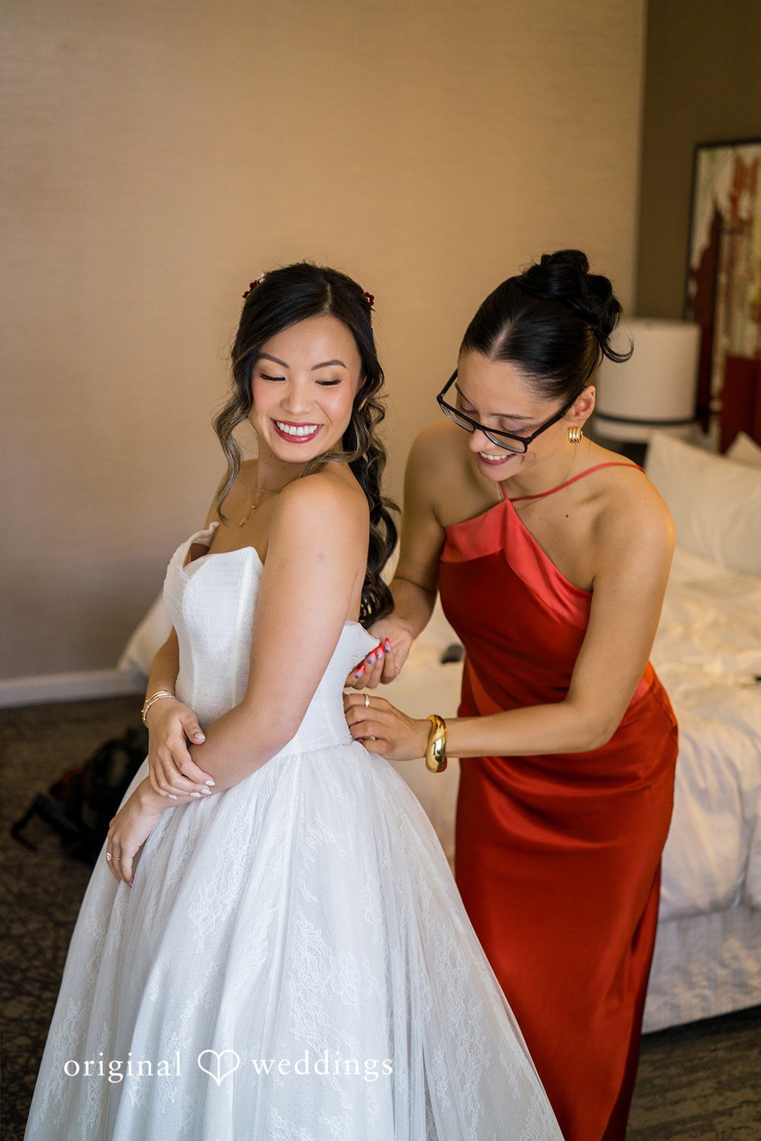 Someone helping the bride get ready at Lytle House