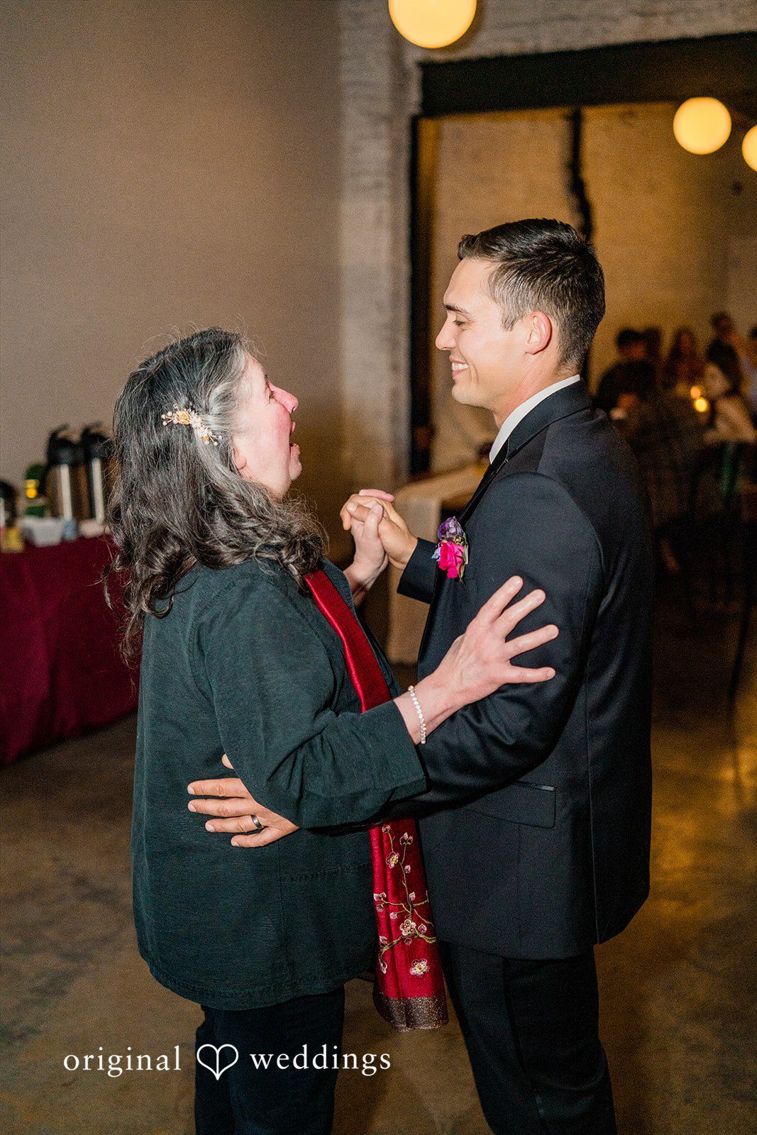 Groom dancing with guests at Lytle House