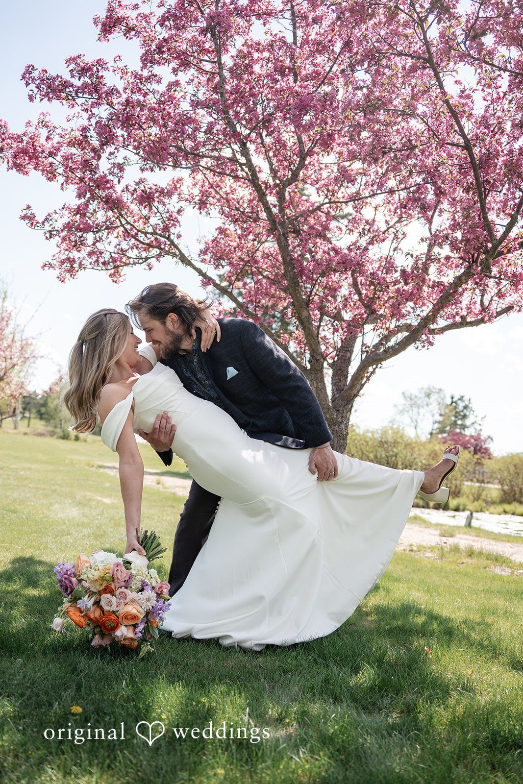 Annie + Andrew Bride and groom posing for wedding photography at Madden's On Gull Lake