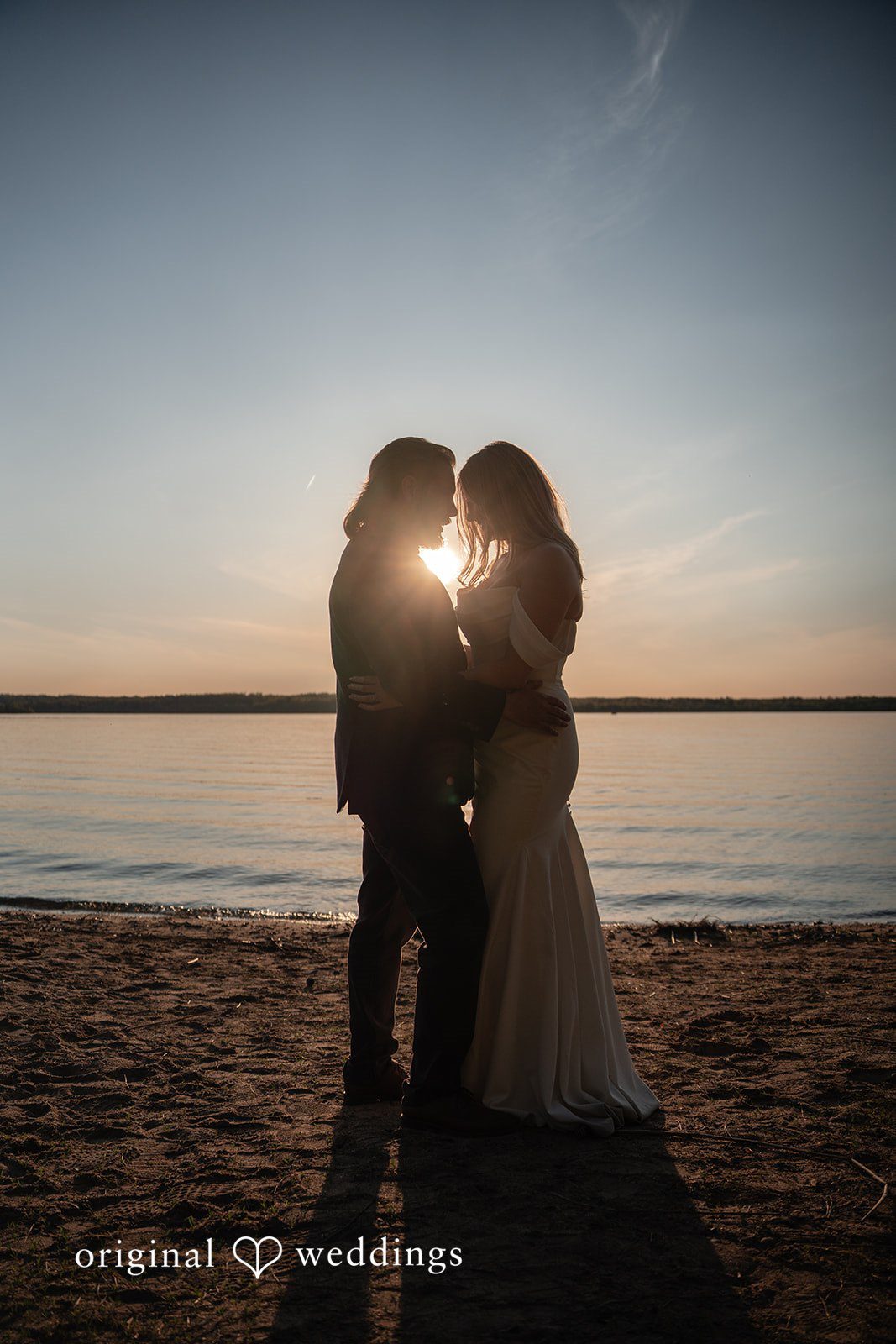 Annie + Andrew Amazing picture of couple with the sun shot in between