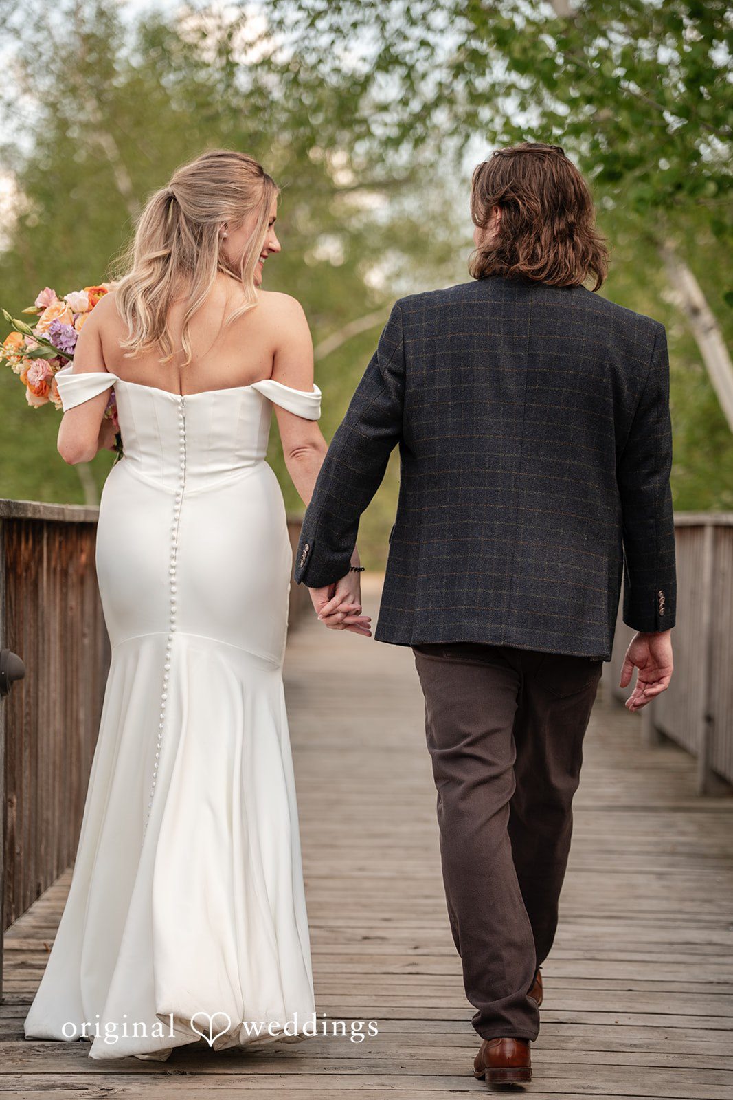 Annie + Andrew Picture of couple captured from back side at Madden's On Gull Lake