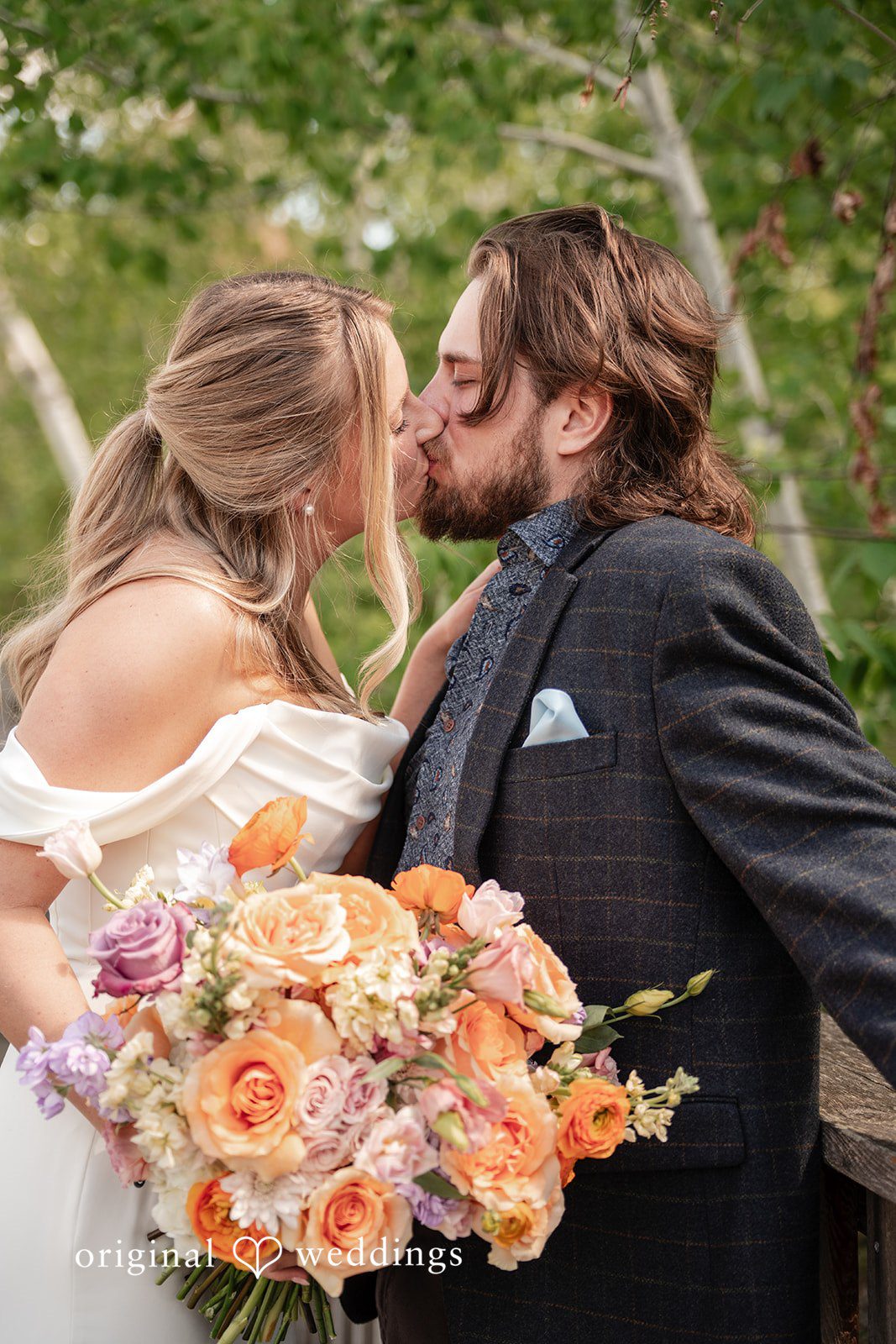 Annie + Andrew Couple sharing a kiss at Madden's On Gull Lake