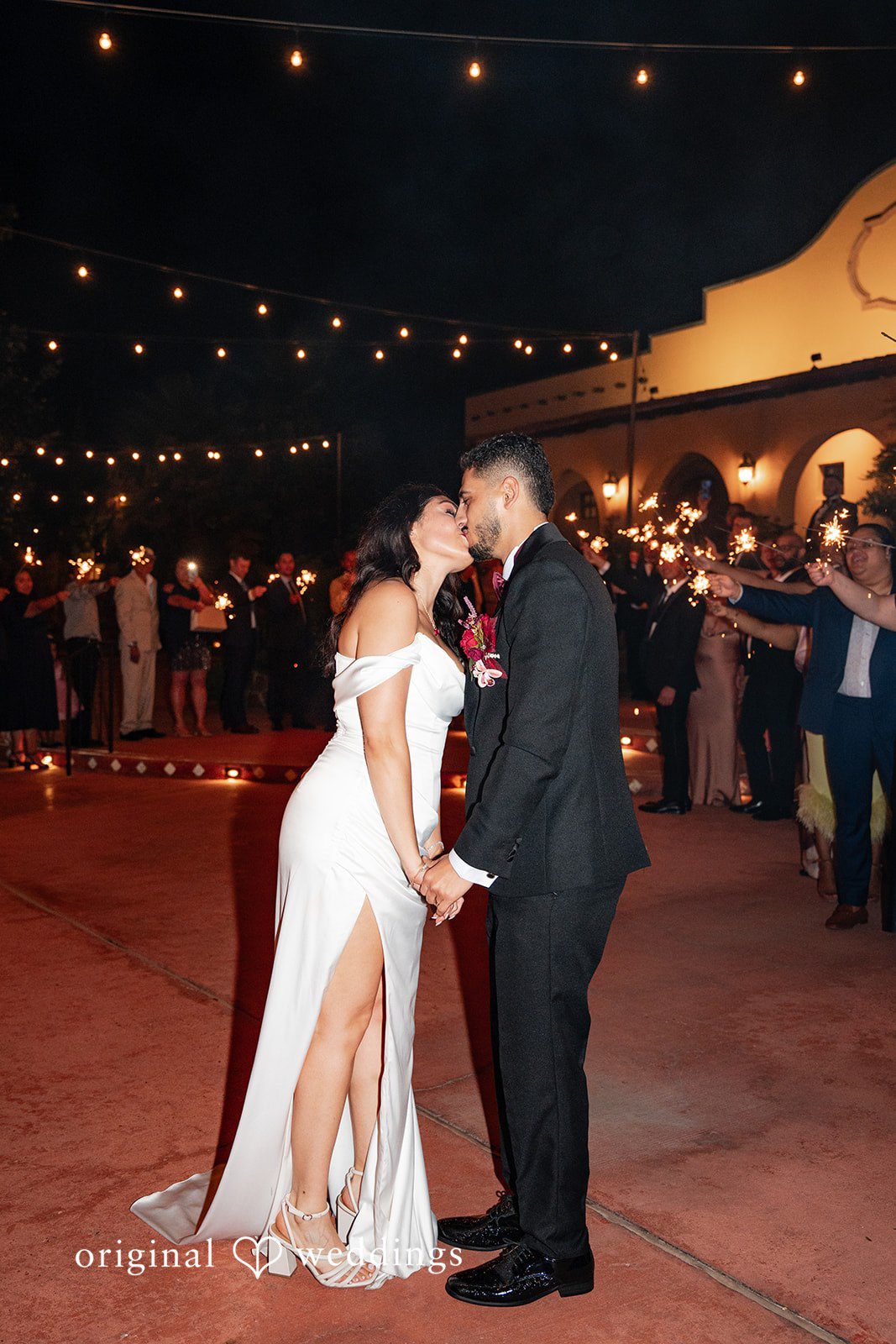 Vanessa + Abdelrahman The couple seals the night with a kiss