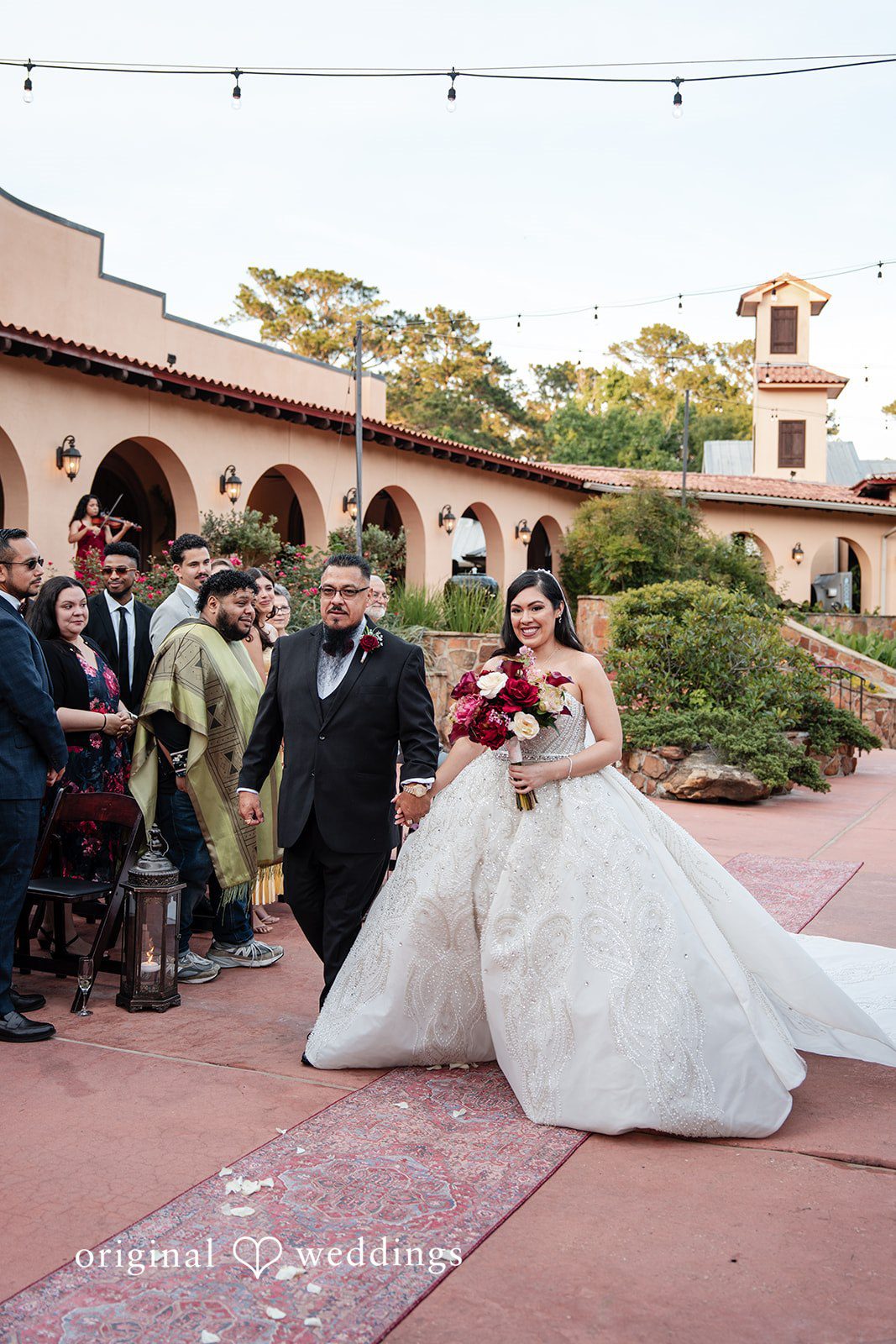 Vanessa + Abdelrahman The bride's father escorts the bride down the aisle