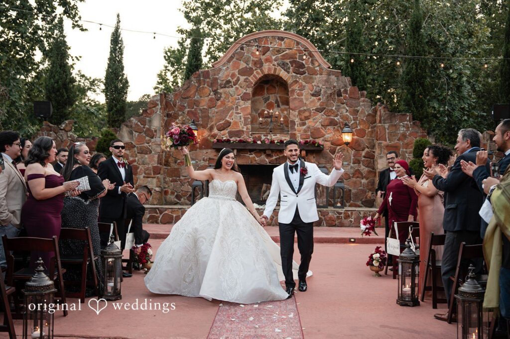 Vanessa + Abdelrahman Our Houston wedding photographers at Original Weddings captured the moment the couple made a joyful exit after their wedding ceremony