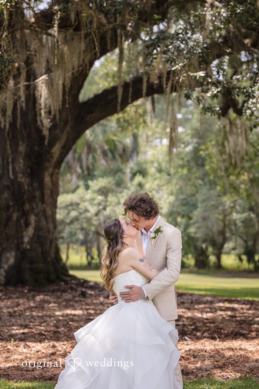 Madison + Aiden Elegant wedding portrait capturing a loving kiss