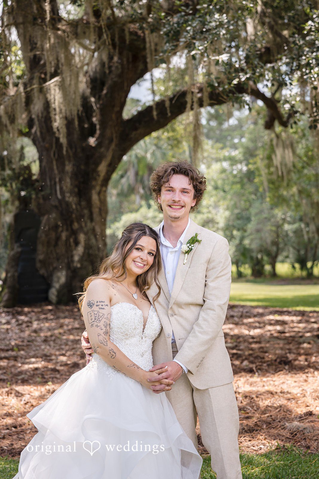 Madison + Aiden Romantic wedding portrait surrounded by Southern oak trees