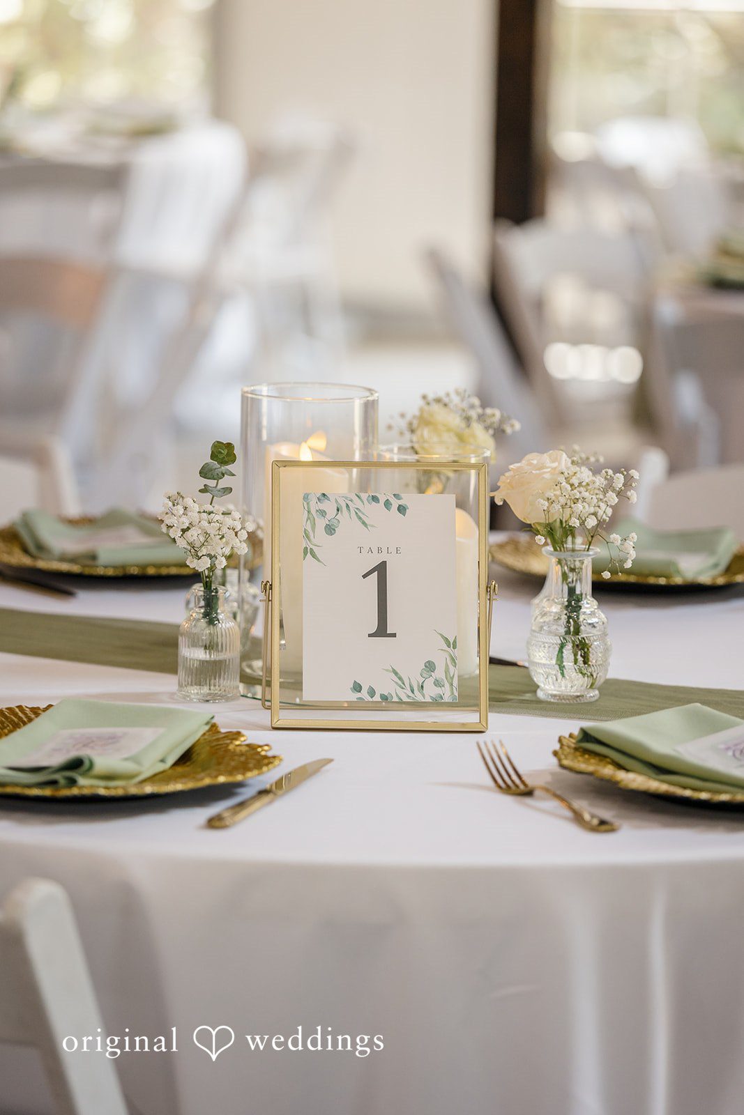 Madison + Aiden Wedding reception centerpiece with elegant place settings and candles