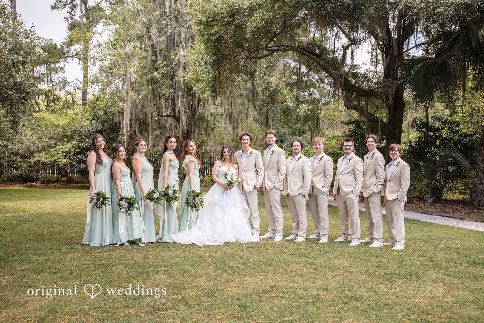 Madison + Aiden Wedding group Portrait at Magnolia Plantation and Gardens captured by Charleston Wedding Photographers from Original Weddings