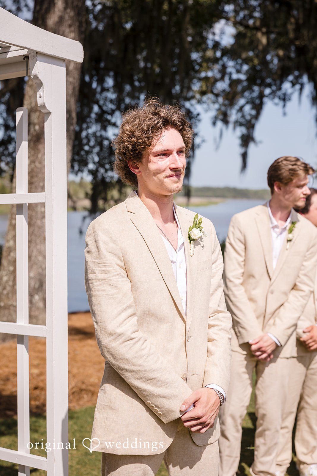 Madison + Aiden Groom waiting at the ceremony altar at Magnolia Plantation and Gardens