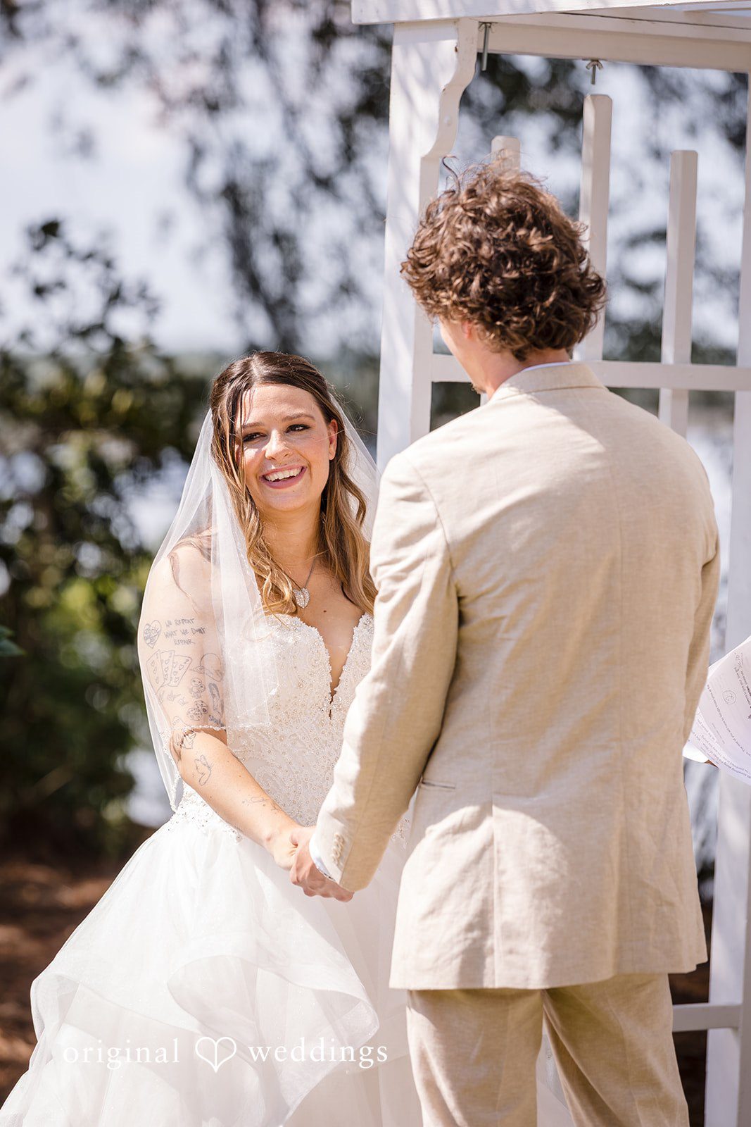 Madison + Aiden Bride and groom holding hands during their ceremony at Magnolia Plantation and Gardens