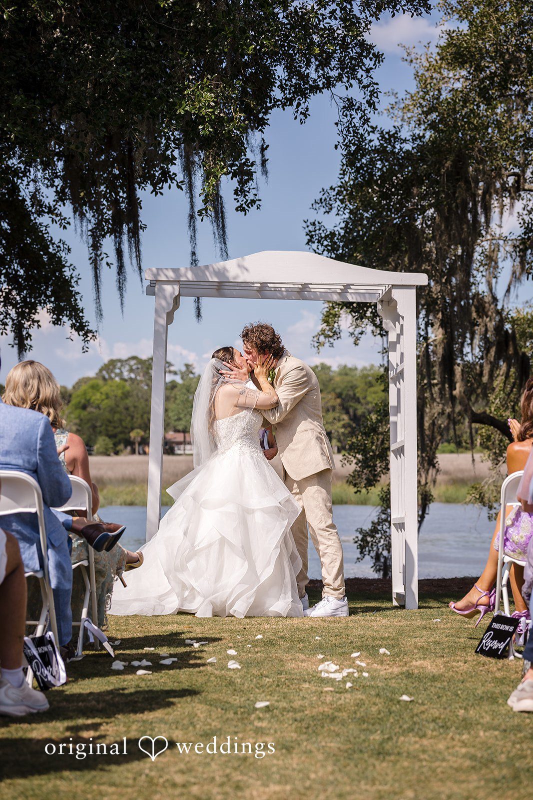 Madison + Aiden Bride and groom sharing their first kiss as newlyweds