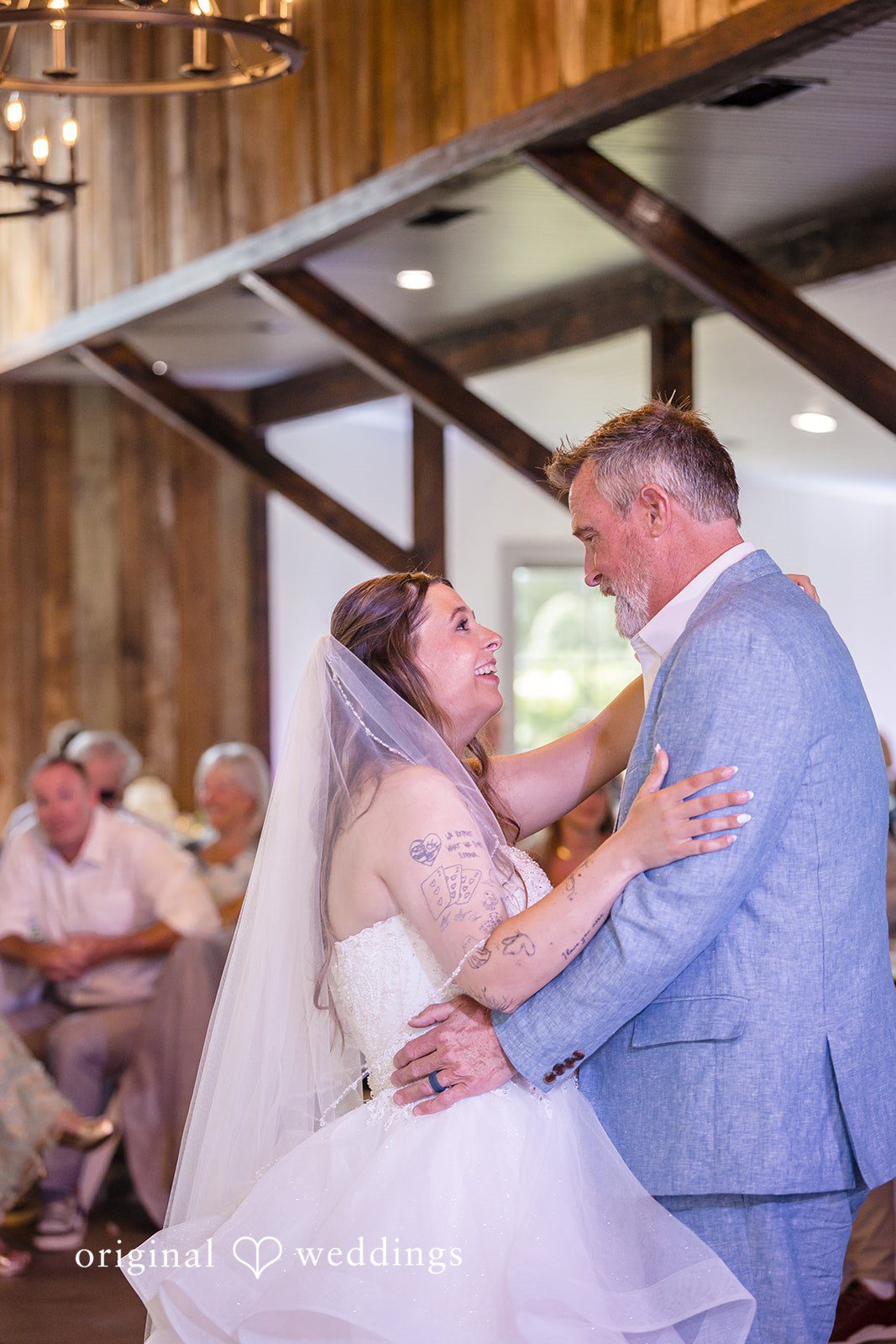 Madison + Aiden Bride smiling while dancing