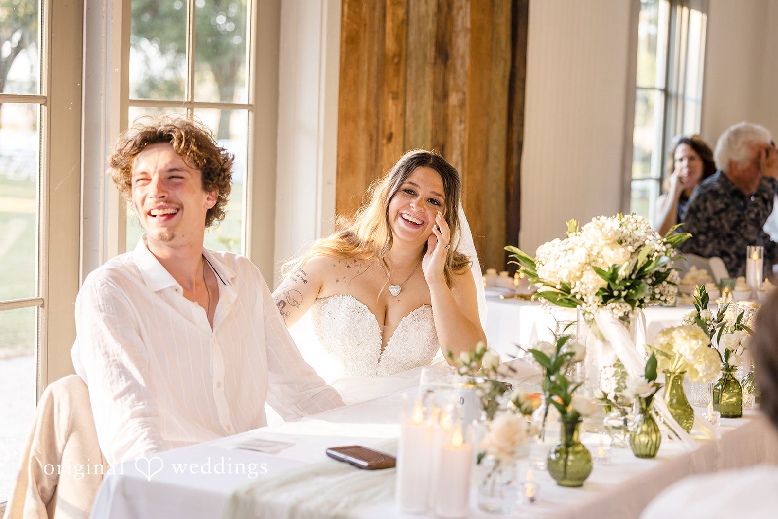 Madison + Aiden Newlyweds sharing laughter during the wedding reception
