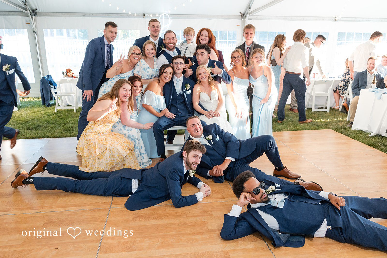 John + Emma Large group photo of wedding guests on a dance floor.