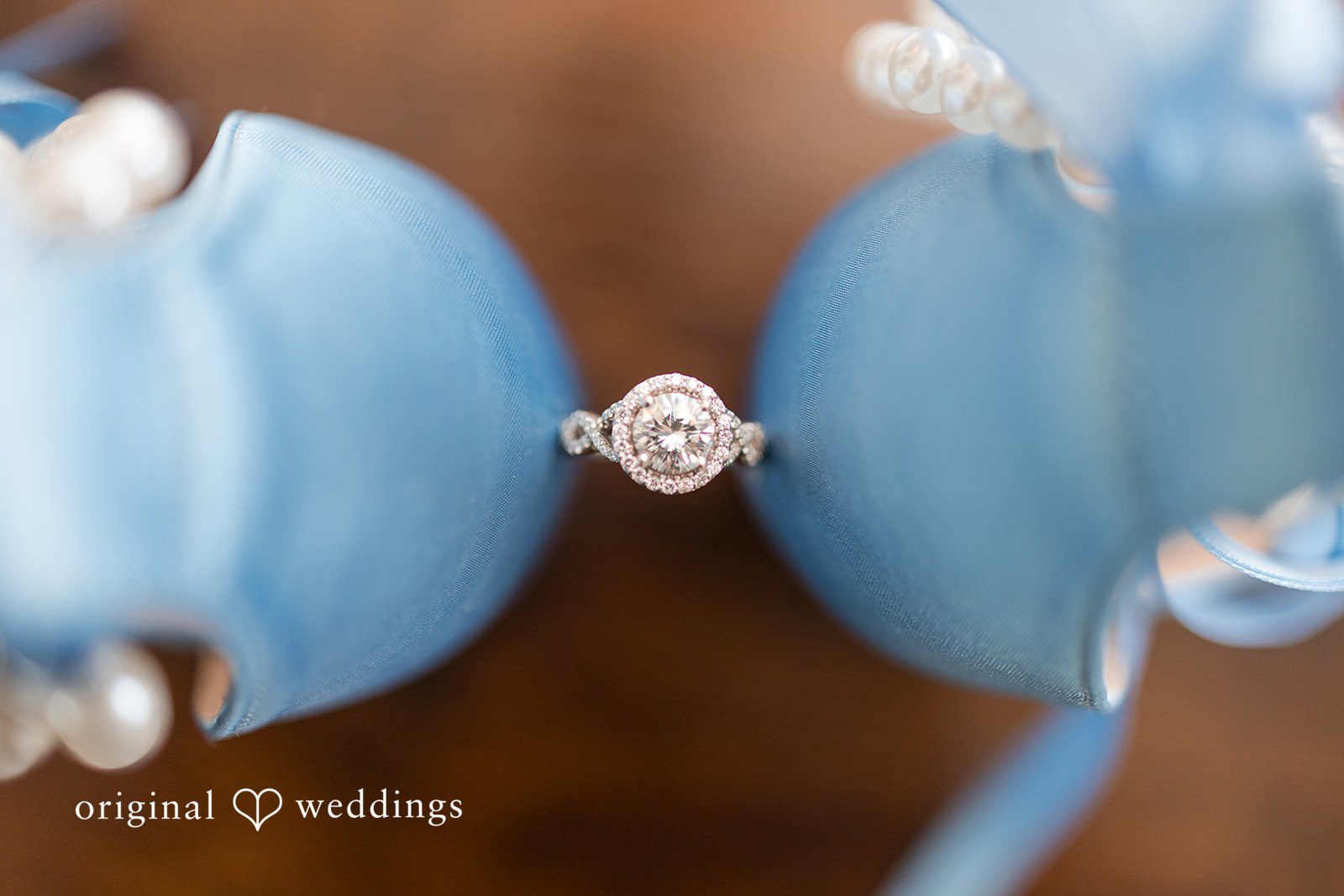 John + Emma Diamond wedding ring resting between two light blue ring boxes.