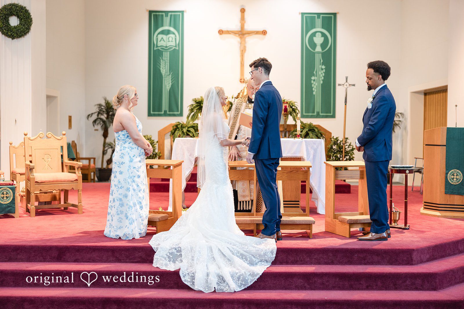 John + Emma Bride and groom standing at the church altar during the service.
