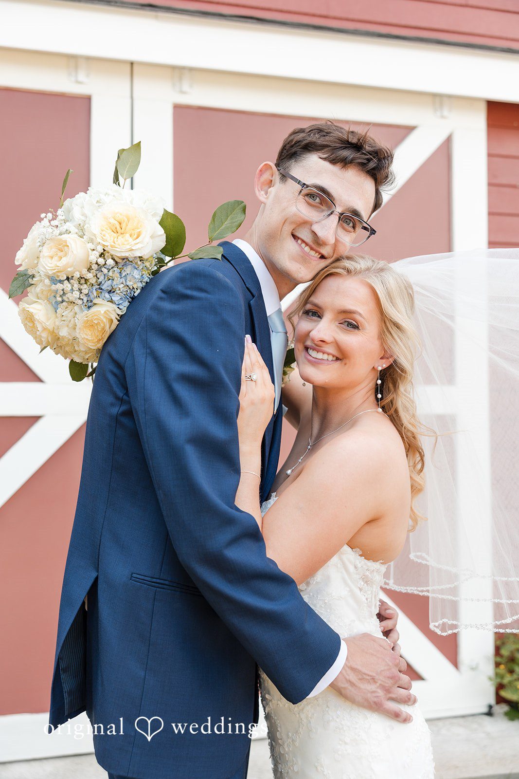 John + Emma Smiling portrait of the couple hugging tightly.