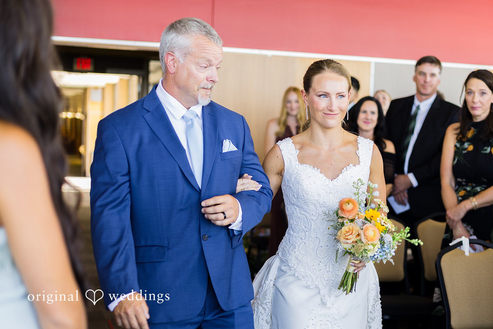 Bride walking down the aisle during the ceremony at Memorial Union.