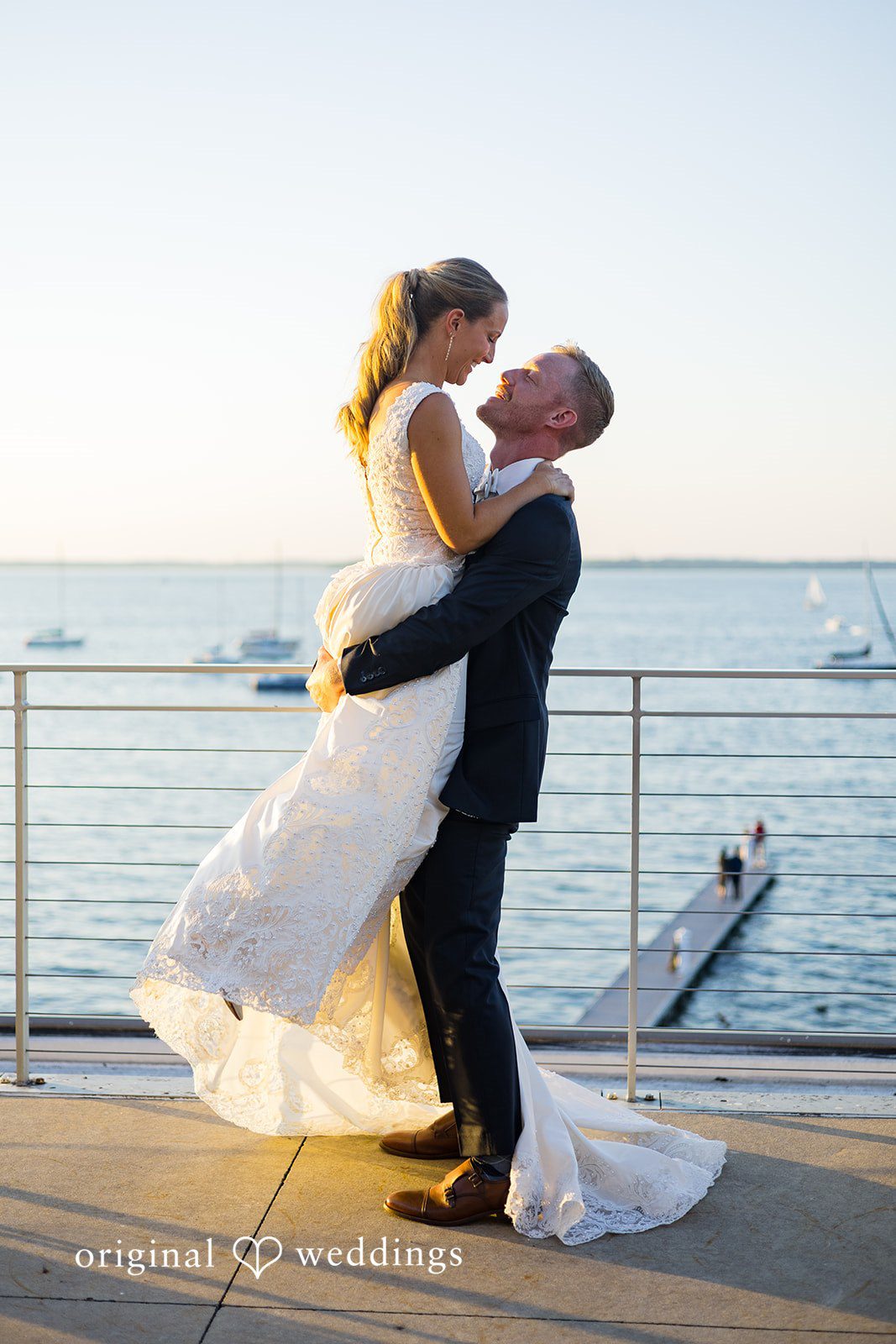 Groom celebrating with a romantic lift during their wedding portraits at Memorial Union.