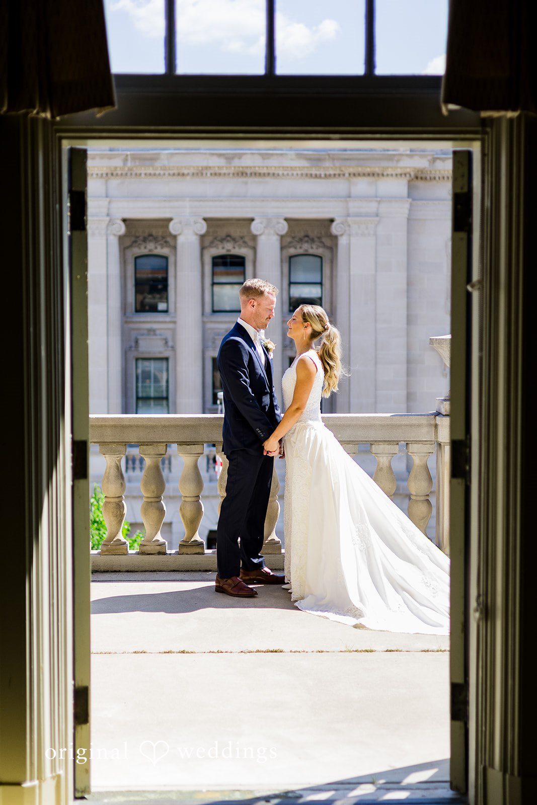 Happy newlyweds celebrating outside at Memorial Union after the ceremony.