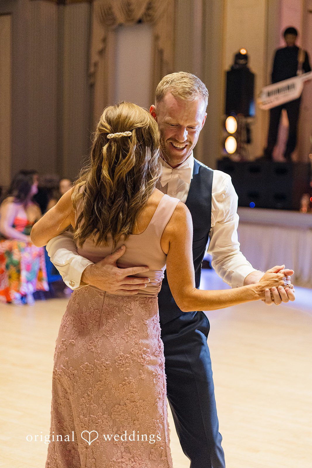 Groom enjoying a dance during the reception at Memorial Union captured by Madison Wedding Photographers from Original Weddings.