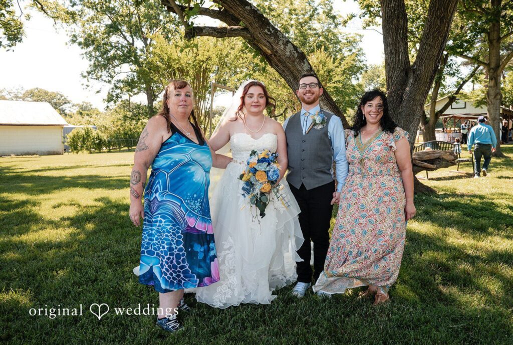 Joshua + Angela Stunning Portrait of couple with guests at Merchant Park by Washington DC Wedding Photographers from Original Weddings.