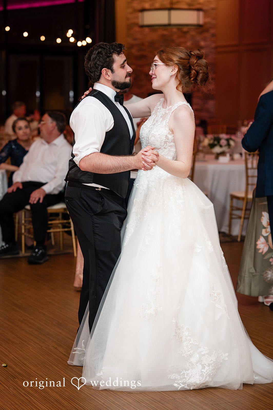 Aislyn + Alex Bride dancing with a groom in a black dress on the dance floor.