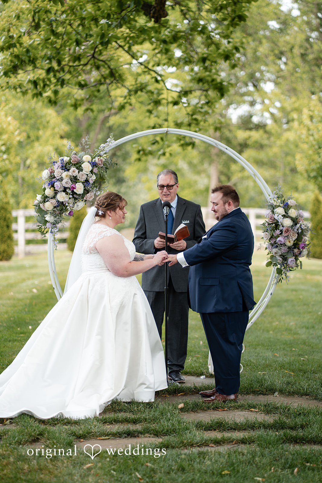 David + Courtney The bride puts a ring on the groom's finger