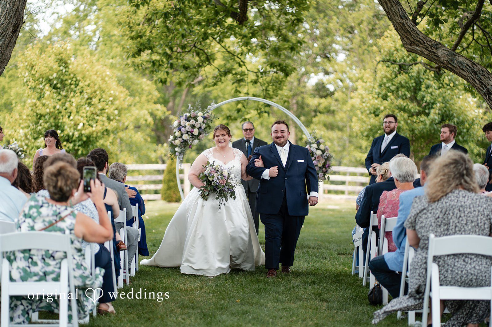 Our Baltimore wedding photographers captured the moment the couple made a joyful exit after their wedding ceremony