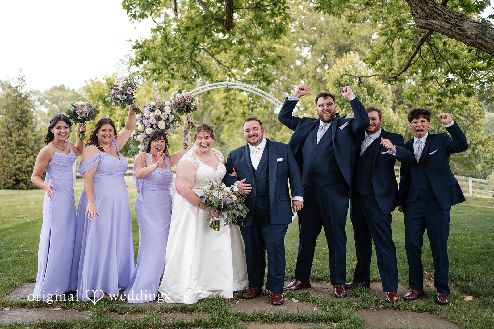 David + Courtney A joyful portrait of the couple and their bridal party