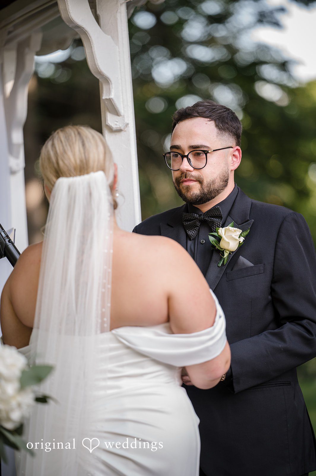 Ashley + Jonathan Close-up of a groom looking affectionately at his bride,