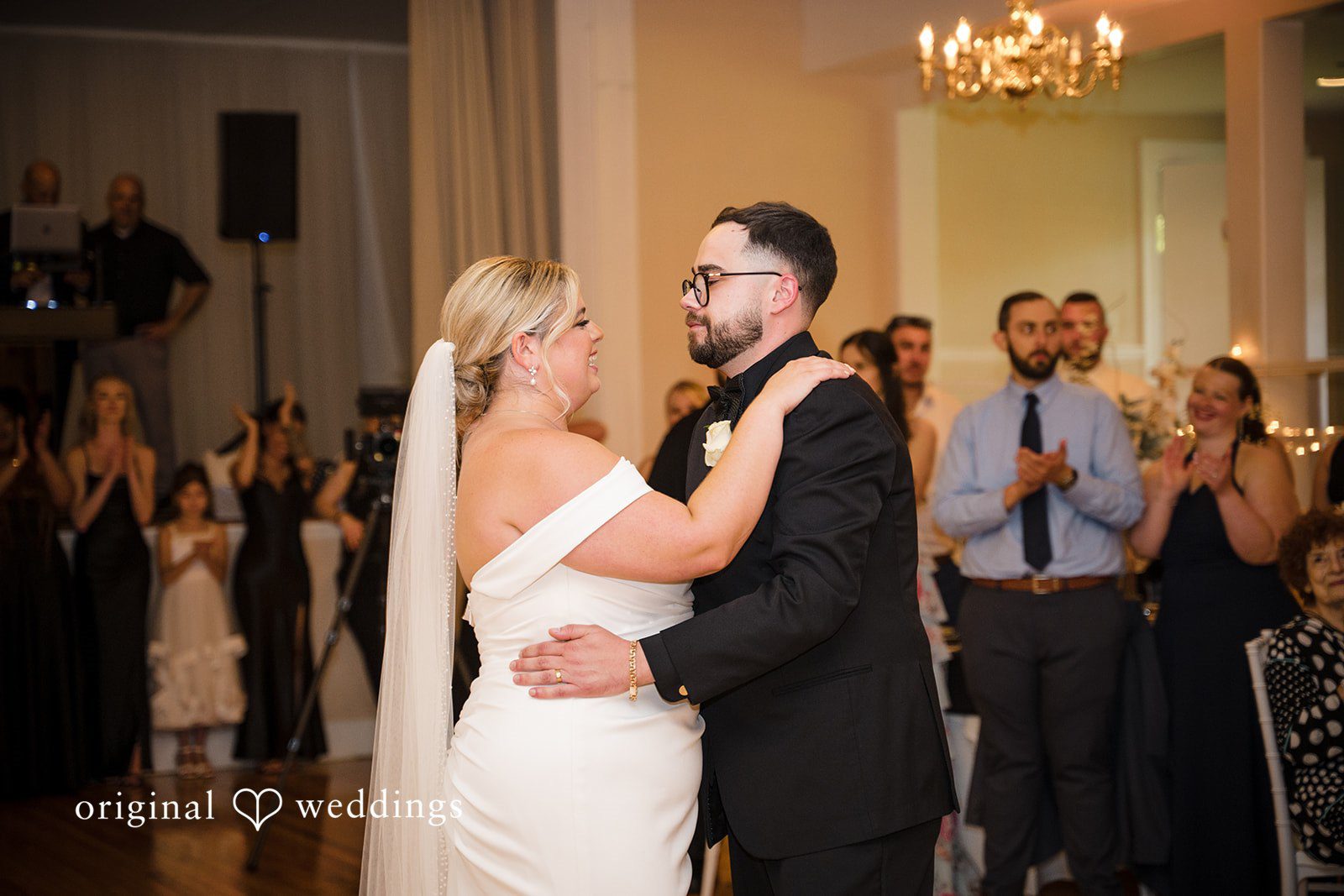 Ashley + Jonathan A bride and groom sharing a romantic slow dance together at their wedding reception.