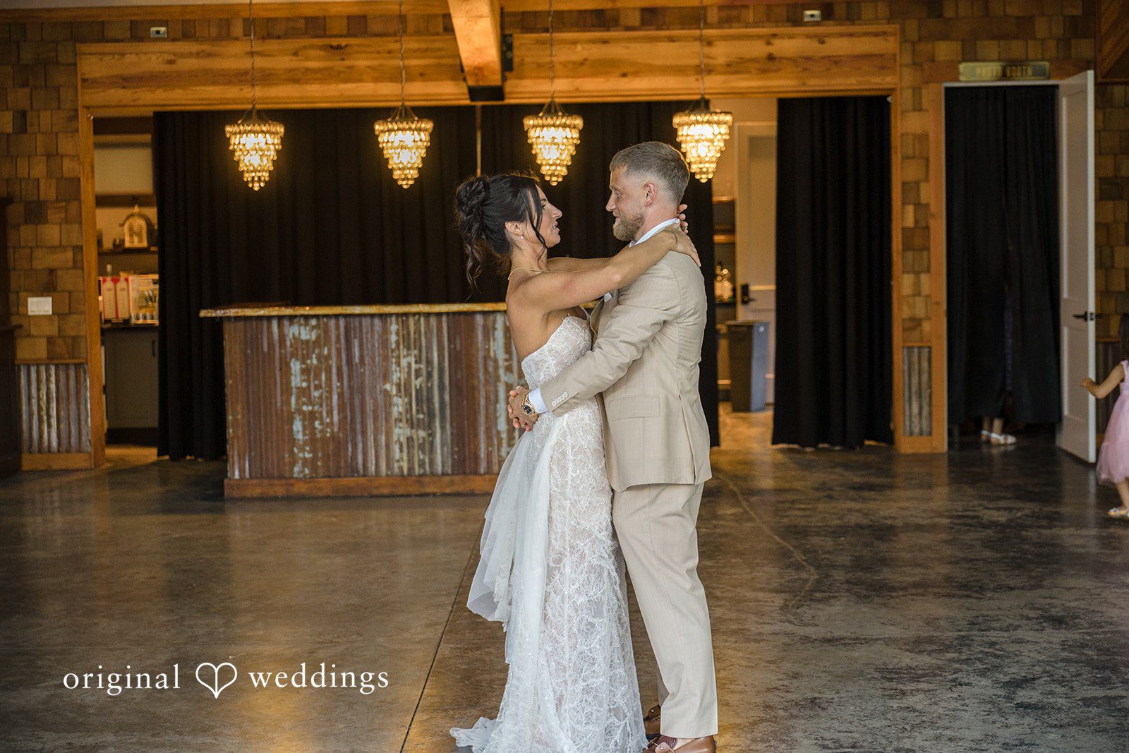 The couple takes their first dance