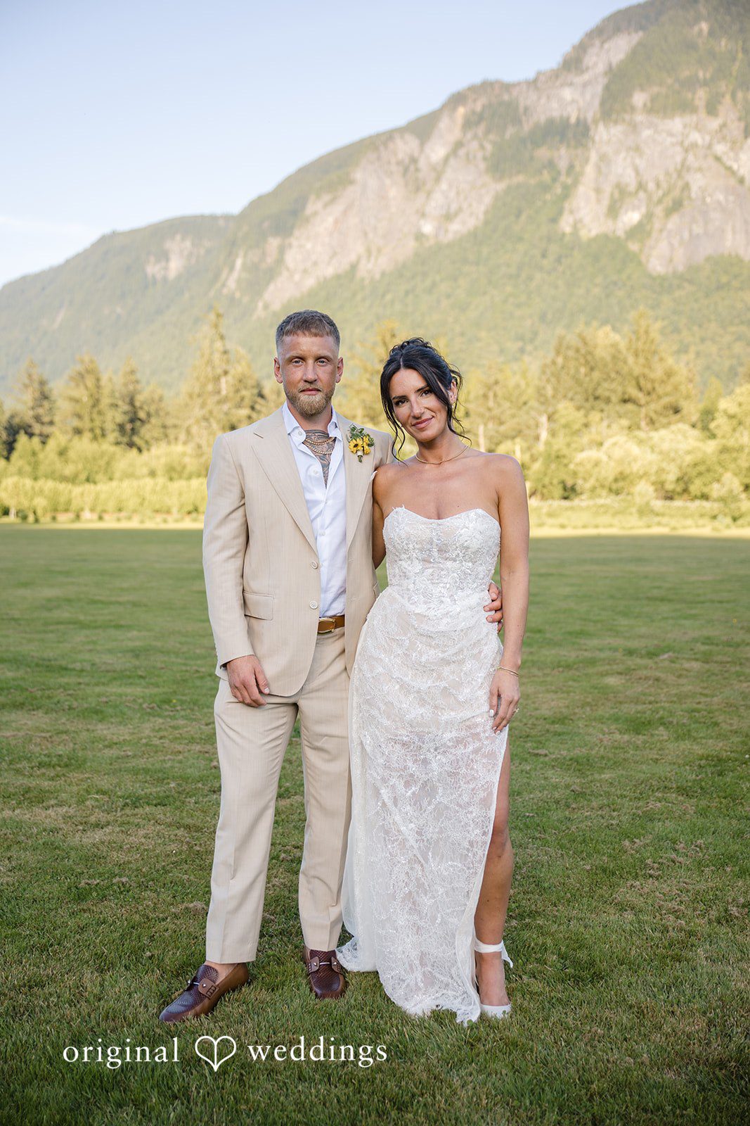 A stunning portrait of the couple with the mountain view behind