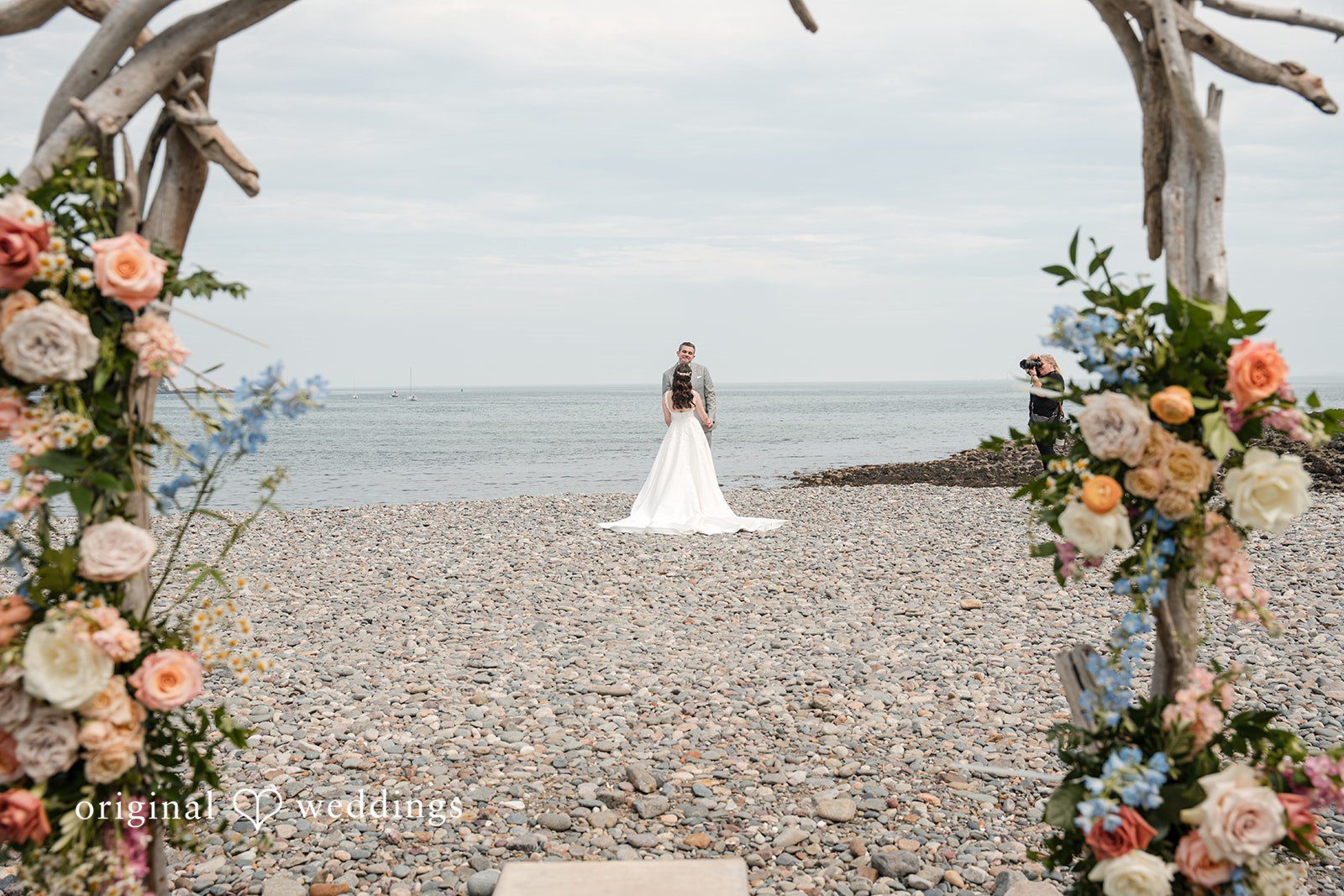 Kerri + David Newlyweds standing together on the pebble beach at Oceanview of Nahant