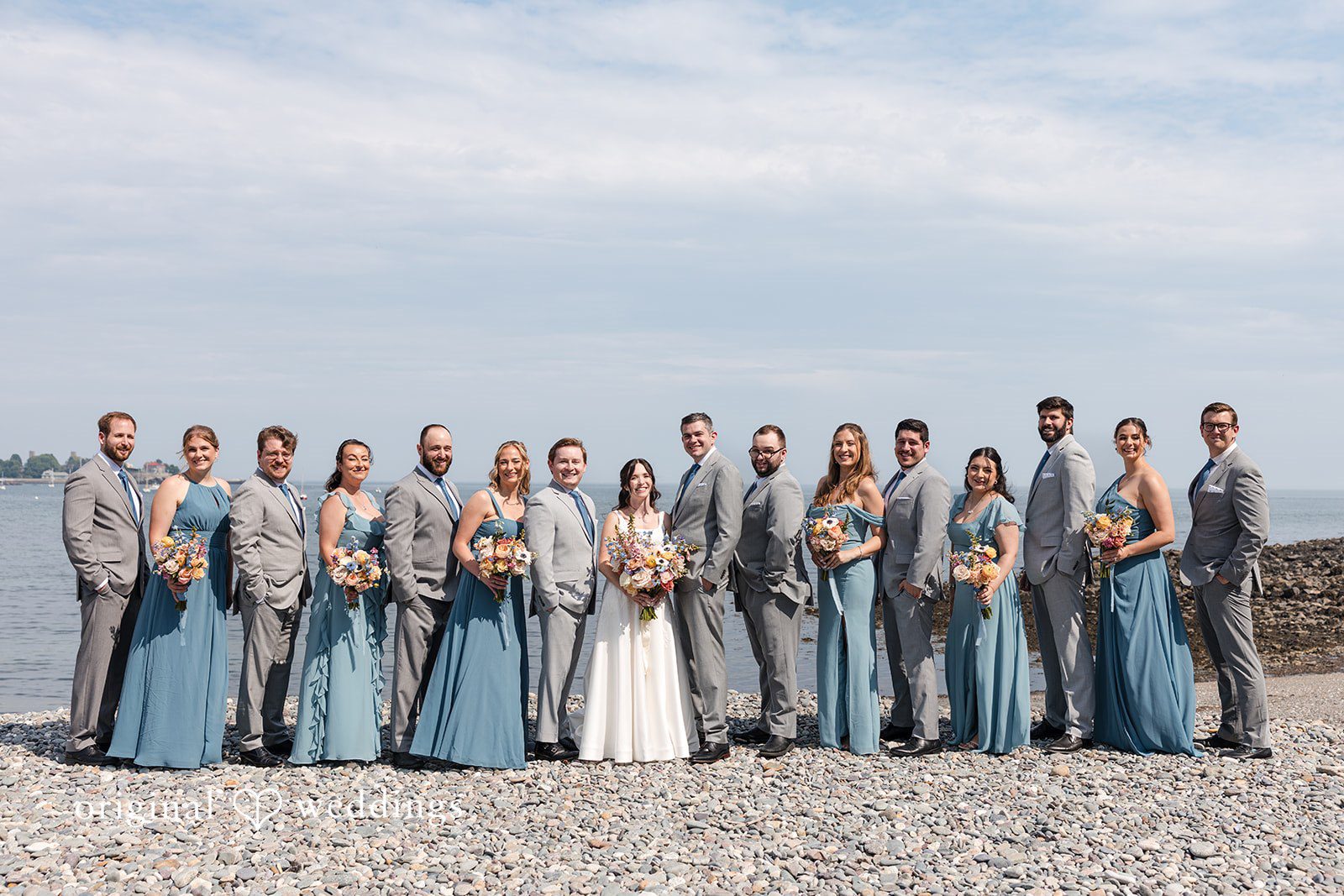 Kerri + David Bride and groom with bridesmaids and groomsmen overlooking the ocean at Oceanview of Nahant captured by Boston Wedding Photographers from Original Weddings
