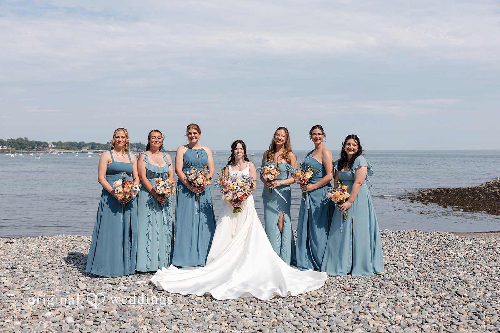 Kerri + David Bride with bridesmaids sharing joyful moments before the ceremony at Oceanview of Nahant