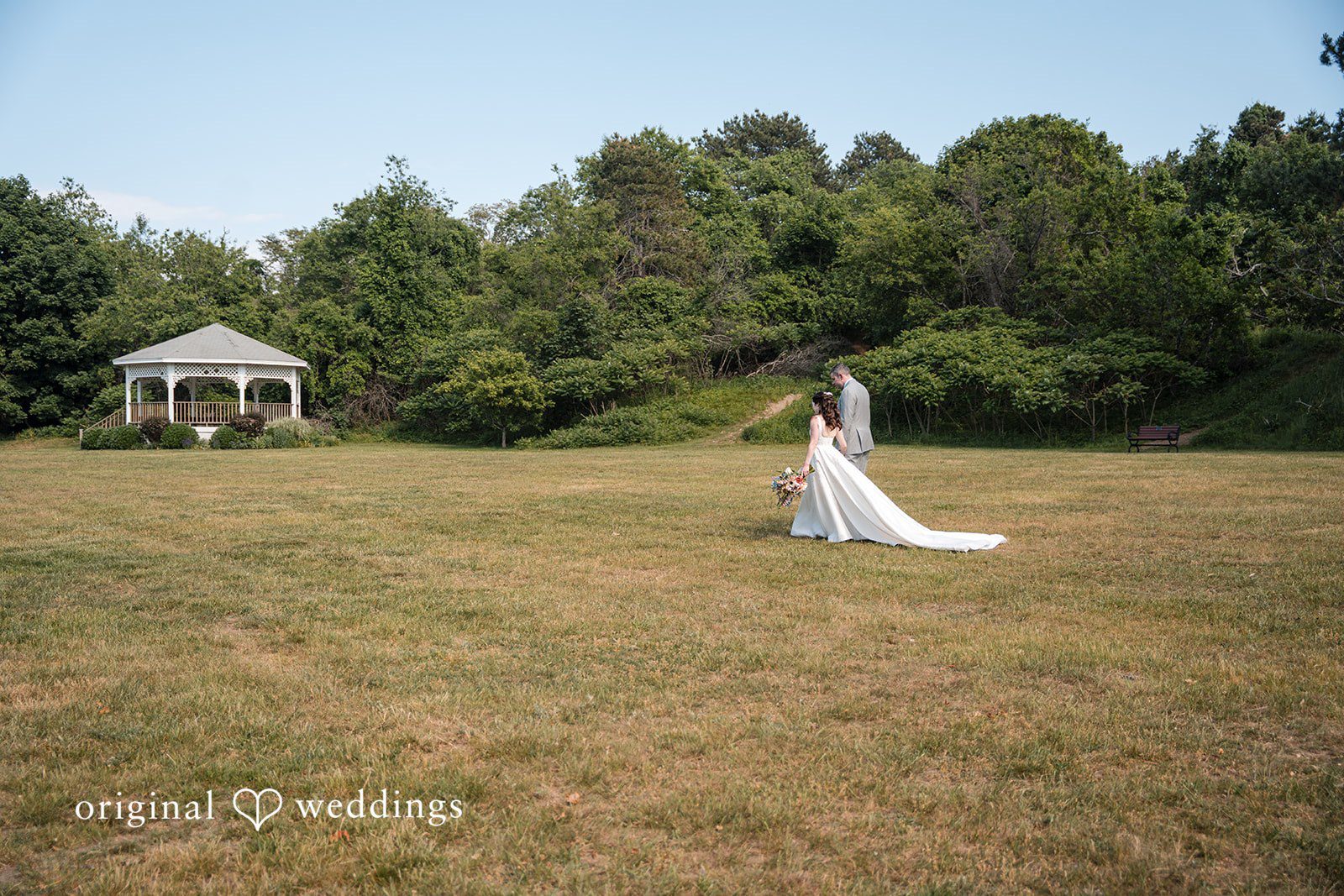 Kerri + David Bride and groom walking hand in hand at Oceanview of Nahant.
