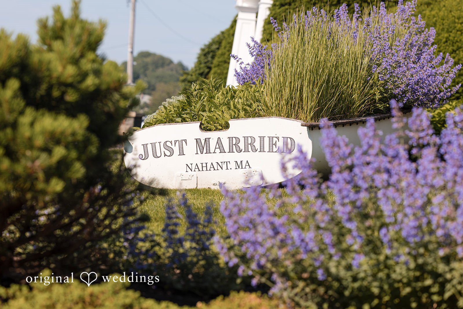 Kerri + David Wedding venue entrance sign with vibrant landscaping at Oceanview of Nahant
