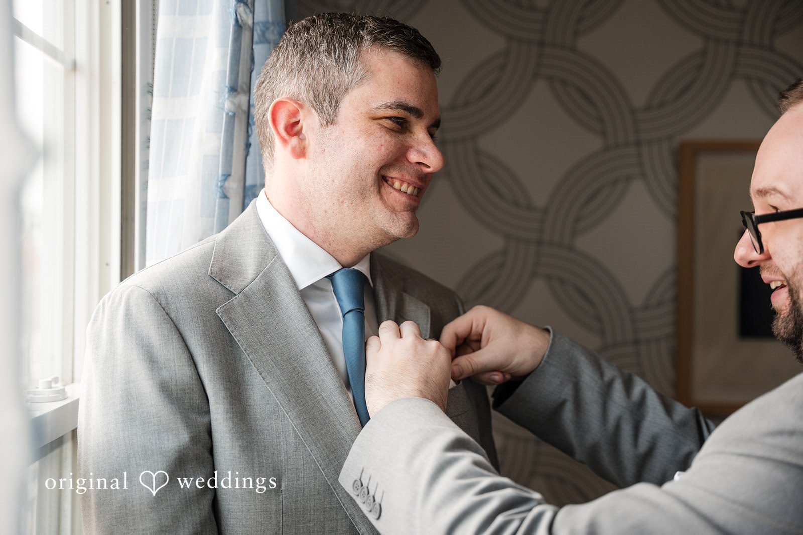 Kerri + David Groom getting ready while adjusting his suit